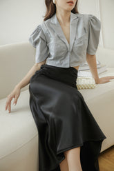 Tailored silk blouse with puffed sleeves and notched collar for elegant structured styling